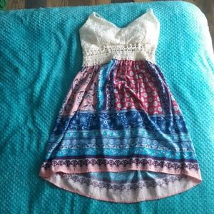 A cream and colorful dress